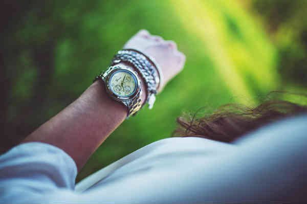 woman looking at her watch