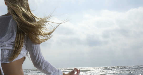 woman meditating outdoors