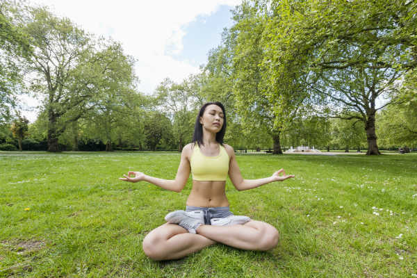 woman meditating in nature