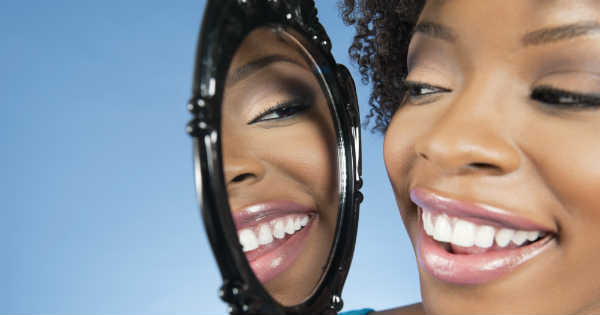 woman talking to mirror