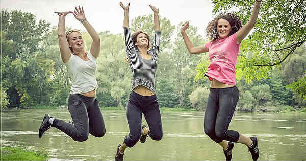 women jumping happily