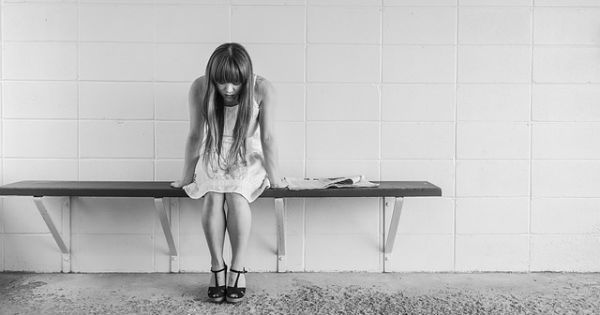 worried woman sitting and waiting