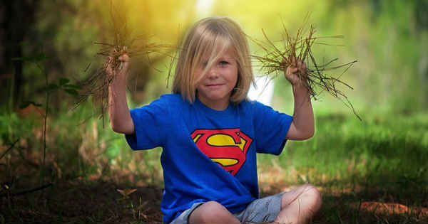 young boy playing in the park